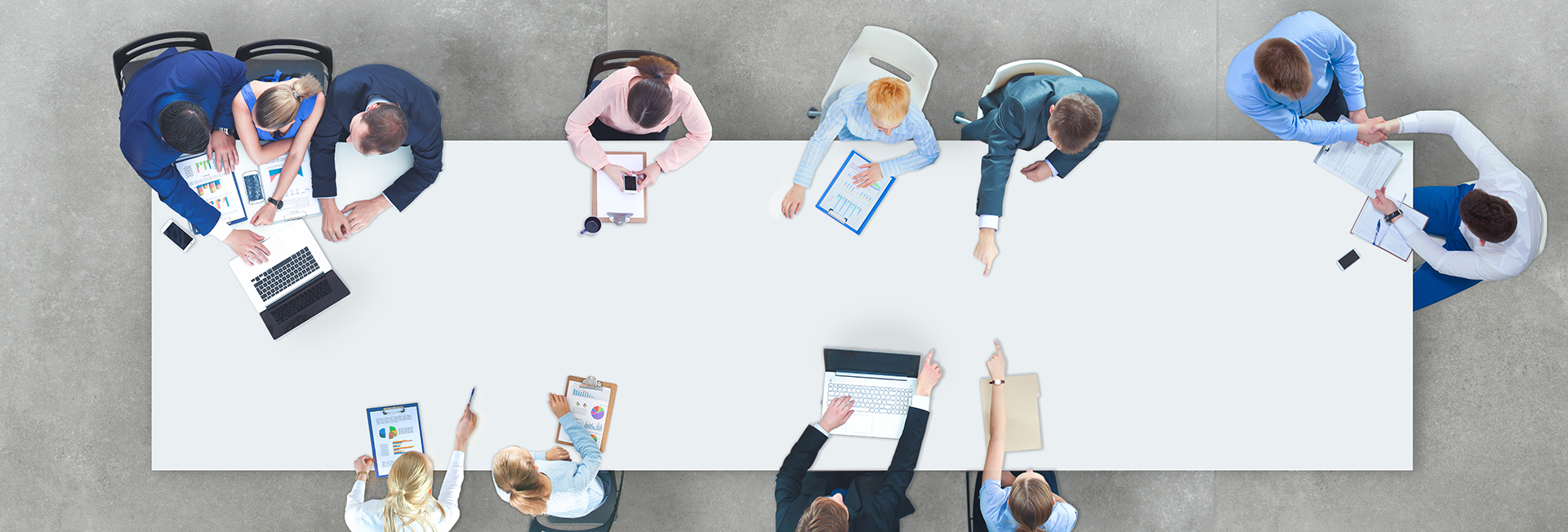 Business people sitting and discussing at business meeting, in office SERVICES